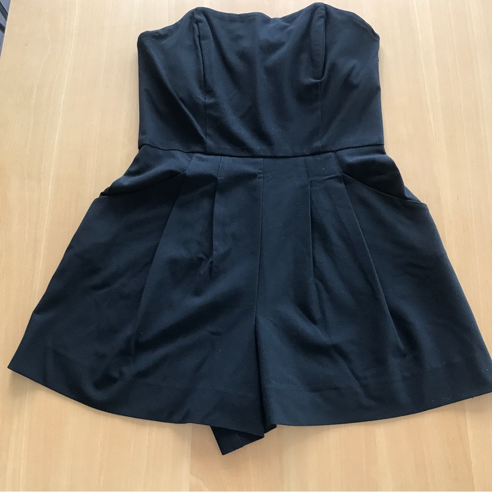 Black strapless romper.